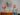blonde woman standing next to candles
